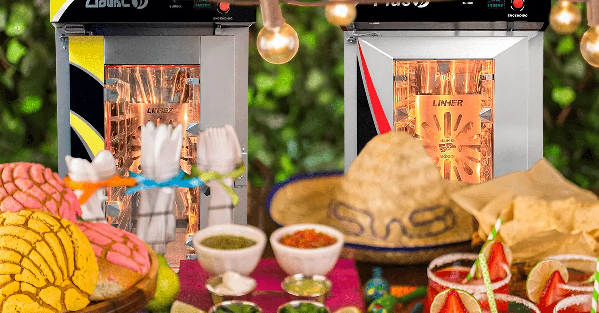 Banquete mexicano con algunos hornos de convección LINHER al fondo